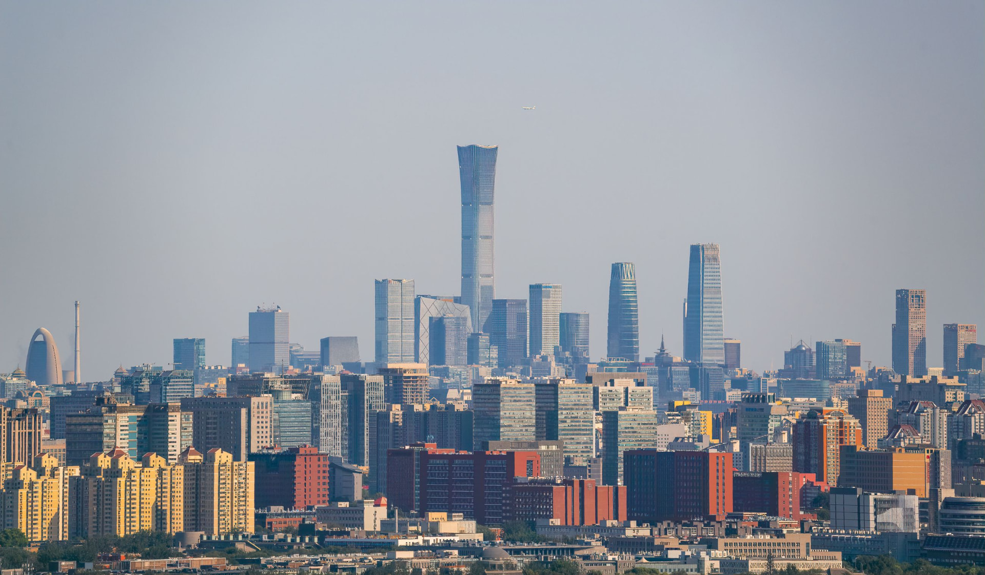 Beijing's central business district skyline, with the China Zun tower and the CCTV headquarters above the surrounding city