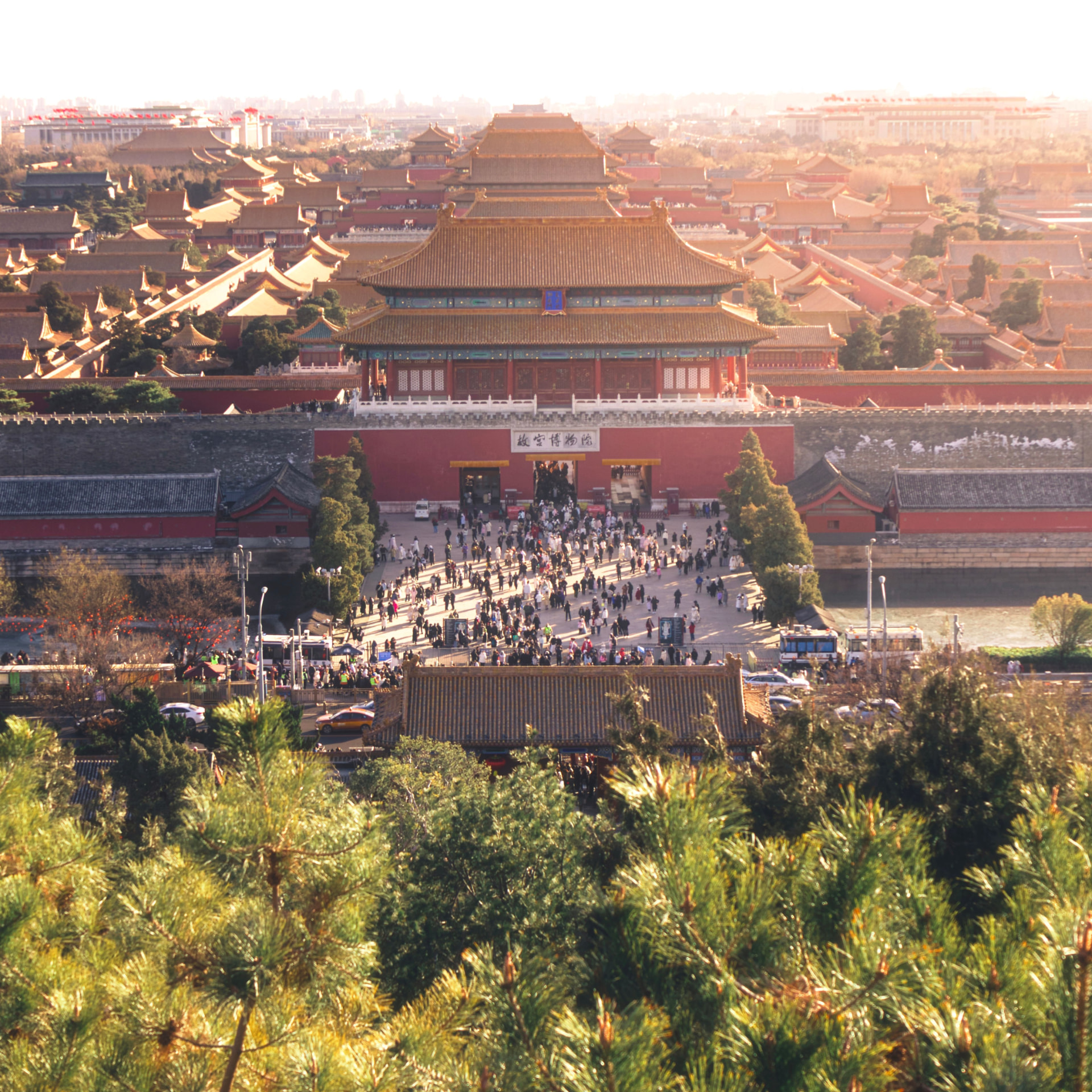 The Forbidden City in central Beijing seen from Jingshan Park, its golden roofs aligned along the palace's central axis